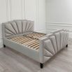 Glamorous, art-deco inspired bed upholstered in luxurious light grey velvet