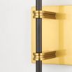 Modern wall sconce with brass fixture for added glamour