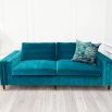 A luxurious teal-coloured 4-seater sofa