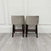 Luxurious counter stools in grey velvet upholstery and complimentary dark brown legs