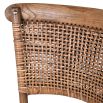 wood and rattan barchair with arching shapes in base