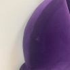Luxurious purple ariel bed with striking headboard detail
