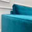 A luxurious teal-coloured 4-seater sofa