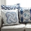A luxury cushion by Eva Sonaike with a blue African-inspired pattern