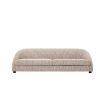 A luxurious modern Mademoiselle Beige sofa with sloped arms