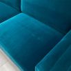 A luxurious teal-coloured 4-seater sofa