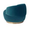 Small and circular blue swivel chair with rounded edges and brass base
