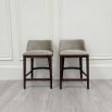 Luxurious counter stools in grey velvet upholstery and complimentary dark brown legs