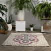 Striking patterned rug with red details and batik style