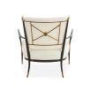 Black framed armchair with brass accents and linen seat and back cushions