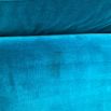 A luxurious teal-coloured 4-seater sofa