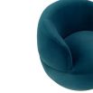 Small and circular blue swivel chair with rounded edges and brass base