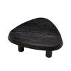 Black wooden coffee table with pebble-shaped top and three legs