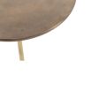 Brass round accent table mounted on black iron base