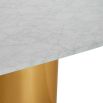 Brass cylinder base dining table with white marble top