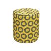A luxury pouffe by Eva Sonaike with a yellow African-inspired pattern