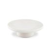 Striking round outdoor coffee table in cream coloured concrete