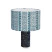 A luxury lampshade by Eva Sonaike with an indigo African-inspired pattern