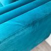 A luxurious teal-coloured 4-seater sofa