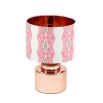 A luxury lampshade by Eva Sonaike Odi with a pink African-inspired pattern 