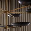 Black discs mounted on brass fixture