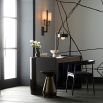 metallic side  table with a round top and tapered neck