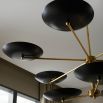 Black discs mounted on brass fixture