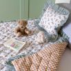 kids quilt and cushion set with blueberry design and ruffled striped edges