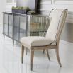 Neutral upholstered dining chair with metal frame