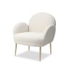 Artisan curved armchair finished in boucle sand with brass legs