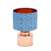 Dreamy blue lampshade with repeated leaf pattern and copper interior