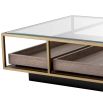 Brass frame coffee table with sleek glass top and slide out wooden trays