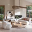 Elegant rounded boucle sofa with subtle wingback