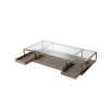 Brass frame coffee table with sleek glass top and slide out wooden trays