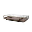 Brass frame coffee table with sleek glass top and slide out wooden trays