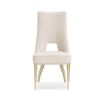 Neutral upholstered dining room chair with peak-through lower back