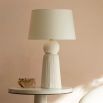 Elegant table lamp resembling a white tassel