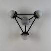 Elegant black gunmetal triangular structure with four orb shades