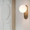 wall sconce with beautiful brushed brass finish and an elegantly detailed frosted glass bulb