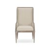 Neutral upholstered dining chair with wooden frame