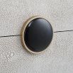 A stylish shagreen box with a white finish and black enamel closure