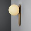 wall sconce with beautiful brushed brass finish and an elegantly detailed frosted glass bulb