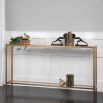 Sleek gold console table with mirror glass top