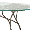 Opulent coffee table with leaf design brass base and round glass top
