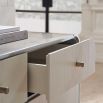 Ivory dresser with brass exterior and geometric base