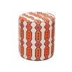 A luxury pouffe by Eva Sonaike with an orange African-inspired pattern