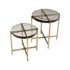 A stylish set of side tables with handmade glass tops and a vintage brass finish