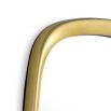 A luxury wall mirror by Eichholtz with an organic shape and glamorous gold finish