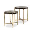 A stylish set of side tables with handmade glass tops and a vintage brass finish