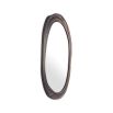 An organically shaped wall mirror by Eichholtz with a textured bronze highlight finish